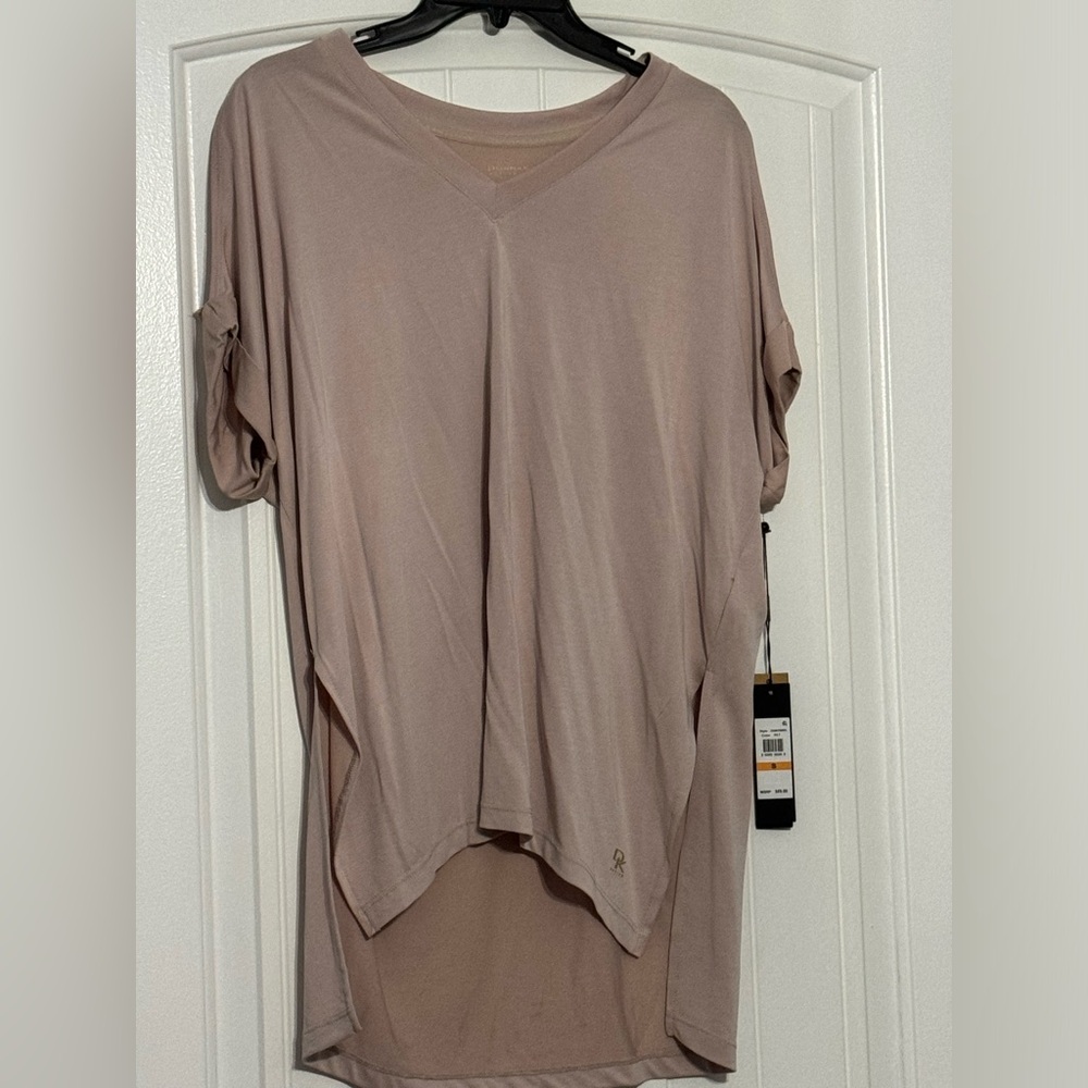 Short sleeve shirt with cut out shoulders shirt is a peachy pink color - Picture 1 of 4